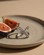 Anillo Geminidas con circonitas blancas de 1 mm en talla circular.