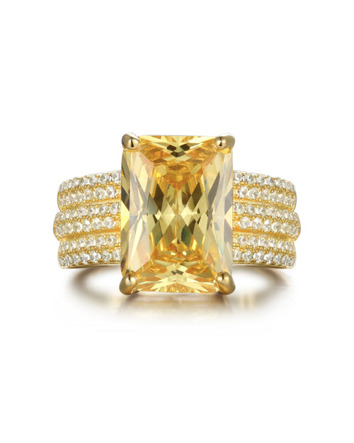 Anillo Deco en plata de ley 925 con baño de oro amarillo de 18kts y piedra principal de 10x14 mm en talla princesa, inspirado en el estilo geométrico del Art Decó