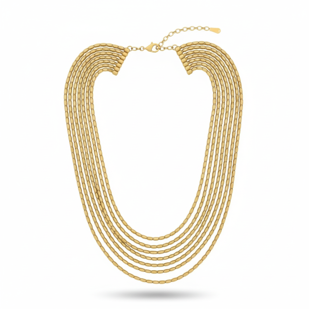 Collar PEDRI dorado de Sibela Studio formado por 7 cadenas en capas escalonadas.