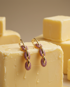 Pendientes Coralina de Sibela Studio con piedras rosas y diseño contemporáneo.