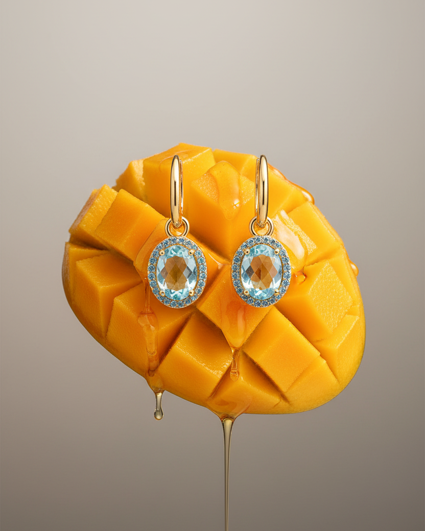 Pendientes con brillo azul y acabado dorado, sofisticados y llenos de luz.