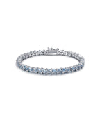 Pulsera MET con piedras azul aguamarina y acabado elegante en rodio.