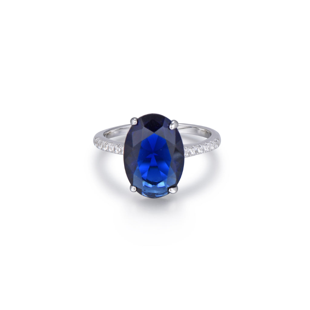 sibila-studio-anillo-deep-sea-con-piedra-central-en talla-oval-azul-zafiro--circonitas-blancas-laterales