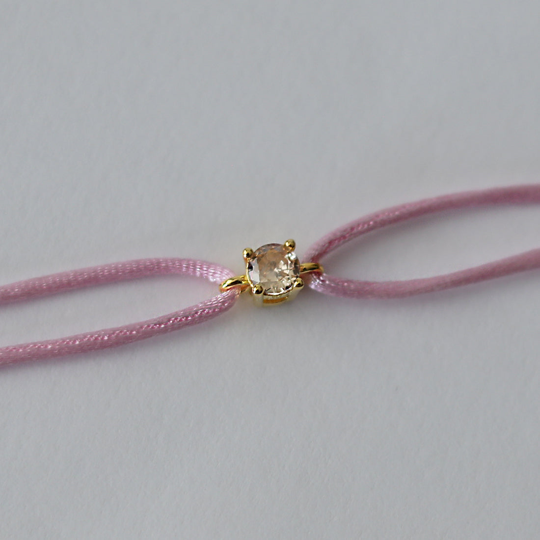 pulsera-tina-oro-amarillo-cuerda-rosa