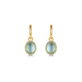 Pendientes Gi con piedra azul aguamarina y acabado en oro amarillo de 18 kt, elegantes y luminosos.