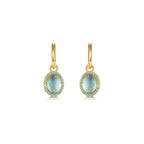 Pendientes Gi con piedra azul aguamarina y acabado en oro amarillo de 18 kt, elegantes y luminosos.